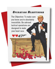Front cover of 0047 Valentine Card Operation Heartthrob with secret agent president in a tuxedo on a gold desk romantic theme with rose petals and hearts