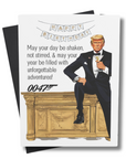 This image features a whimsical birthday card with a playful and unique theme. The front of the card is an illustration of the president in a tuxedo sitting on a golden desk, with the iconic phrase "May your day be shaken, not stirred, and may your year be filled with unforgettable adventures! 0047" written above.