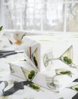 Gift wrapped in paper with martini glass design, two olives inscribed with a 4 and 0.