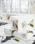 Wrapping Paper featuring a martini glass design and olives on a white background.