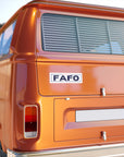 Orange van with FAFO logo on a clear day