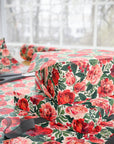 Floral rose and peony wrapping paper in red and blush pink with greenery for Christmas, weddings and birthdays.