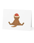 Card with image of the back of an otter wearing a Santa hat on a white background.
