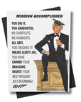 A humorous graduation card featuring a character resembling the President of the United States in a graduation cap and gown, with text 'MISSION ACCOMPLISHED' and other humorous phrases.