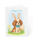 Easter card with a darling King Charles Cavalier Dog in bunny ears sitting by a daffodil and an easter egg.