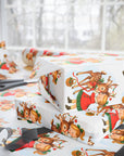 Christmas-themed gift wrap with reindeer and little girl kiss on a white background side view