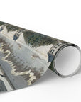 Roll of wrapping paper with a scenic design on a white background
