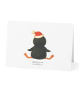 Reverse side of Card with a penguin wearing a Santa hat on a white background
