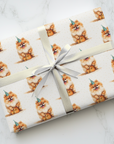 Gift wrapped in paper with Pomeranian pattern on a marble surface