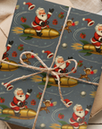 Christmas themed wrapping paper featuring Santa and rudolph riding a rocket through space ready to deliver presents.