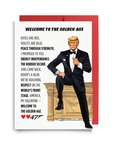 Trump 0047 Valentine's card titled Welcome to the Golden Age featuring Agent 0047 in a mission-ready tuxedo for a patriotic briefing.