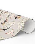 Roll of gift wrap featuring a classic wedding couple pattern with bride and groom and small wedding cake details.