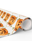 Roll of Halloween-themed paper with jack-o'-lanterns and floral accents on a white background