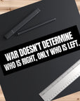 Black mat with a quote sticker and stationery on a wooden surface