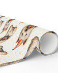 Roll of wrapping paper with dog design on a cream background with confetti