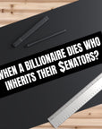 Black bumper sticker with humorous text on a black surface with a pen and ruler.