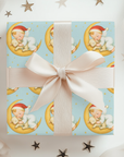 Vintage storybook baby Christmas gift wrap on aqua blue background