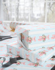 Winter Rose Ballet wrapping paper with pink ballet slippers, frosted roses, and greenery on light blue background