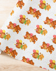birthday wrapping paper roll in a retro theme featuring a bear and lion with balloons on a white background