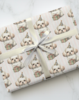 Gift wrapped in wrapping paper with bichon puppy illustrations