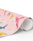 Roll of pink paper with colorful bird illustrations on a white background.