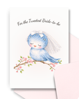 Bride to be card with a bluebird wearing a veil on a blooming branch, with text 'For the Tweetest Bride-to-be' on a white background and corresponding pink envelope.