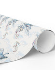 Roll of wedding wrapping paper with a biplane design on a light background.