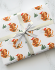 Christmas wrapping paper featuring a retro skiing king charles cavalier puppy in a santa hat on white background.