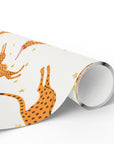 Roll of wrapping paper with cheetah pattern on a white background