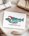 Card with fish wearing a Santa hat and text 'GOT YOU A CHRISTMAS COD' on a festive background with wrapped gifts and pinecones.