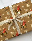 Santa riding camels under the Star of Bethlehem with golden palm trees Christmas Wrapping Paper