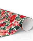 Roll of floral rose and peony wrapping paper in red and blush pink with greenery for Christmas, weddings and birthdays.