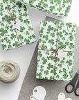 Gift boxes wrapped in green shamrock patterned wrapping paper