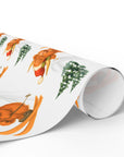 Christmas wrapping paper featuring a highland cow in a santa hat skiing down a snowy hill, set on a white background.