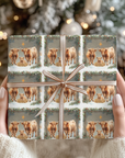 Nativity-inspired Highland cow Christmas wrapping paper featuring two cows and a baby calf in a manger setting with holiday greenery.