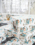 gift wrapped in vintage theme wedding wrapping paper featuring a bride and groom making a quick getaway in their carriage with a sign that says "Just Married".
