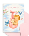 Baby shower card with a baby in a pink hammock, birds, and flowers on a blue sky background.