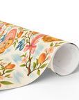 Roll of vintage style baby shower wrapping paper with peach blossoms and bluebirds