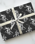 Polo player wrapping paper showing riders on horseback in motion with mallets.