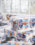 Gift wrap with a birthday-themed design featuring POTUS in a suit carrying balloons and a birthday banner side