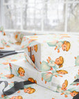 Gift wrap with angel designs on a white background side view