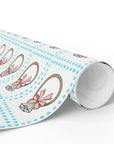 roll of wrapping paper featuring a retro engagement ring with a pink bow