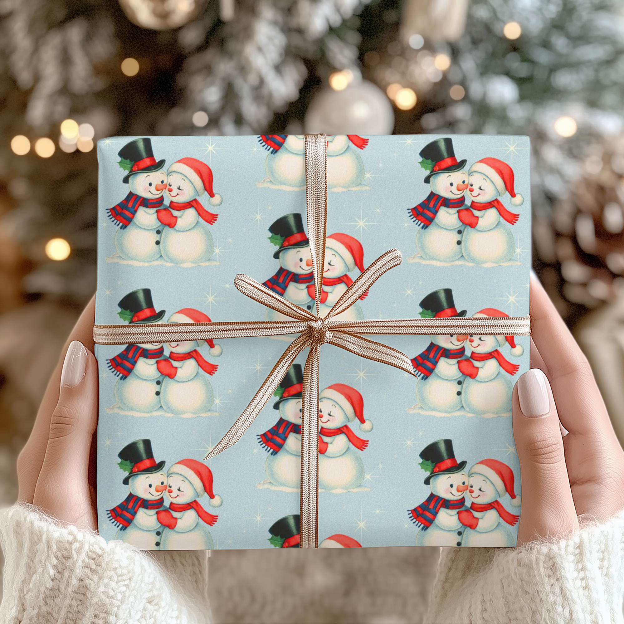 Gift wrapped under the tree  in a Christmas themed wrapping paper with snowmen couple on a blue background
