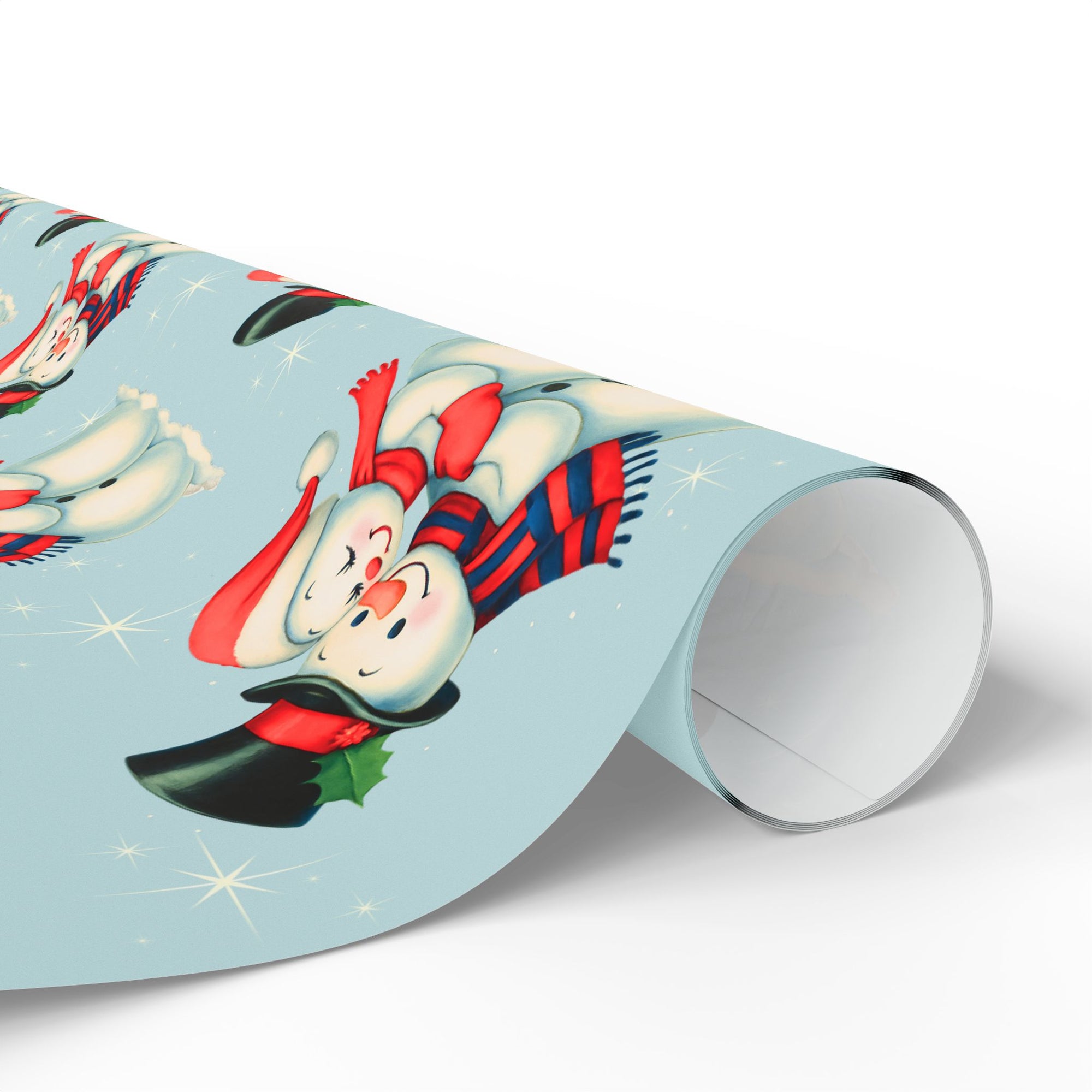 roll of Christmas themed wrapping paper with snowmen couple on a blue background