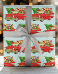 Retro holiday wrapping paper featuring Santa in a 1957 Chevy with gifts and Christmas tree.