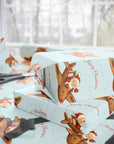 Stack of wrapped presents with Christmas-themed paper featuring reindeer and Santa Claus.