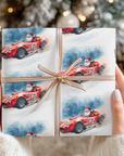Wrapped paper featuring Santa driving a bright red Shelby Cobra style race car, with a usa flag.