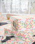 Spring wrapping paper with baby bunnies inside pink flowers and blue butterflies