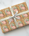 Vintage style Easter wrapping paper with pink bunny ornate gold frame in springtime storybook design.