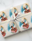 Romantic swan wrapping paper with heart-shaped chocolate box on a light background.